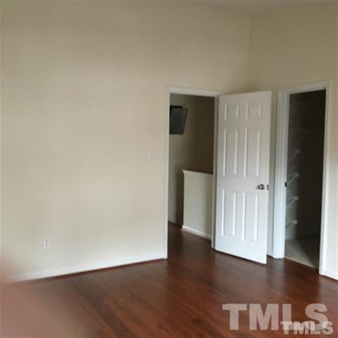 4311 Halliwell Drive Raleigh, NC 27606 - Photo 5 of 21 a view of an empty room with wooden floor