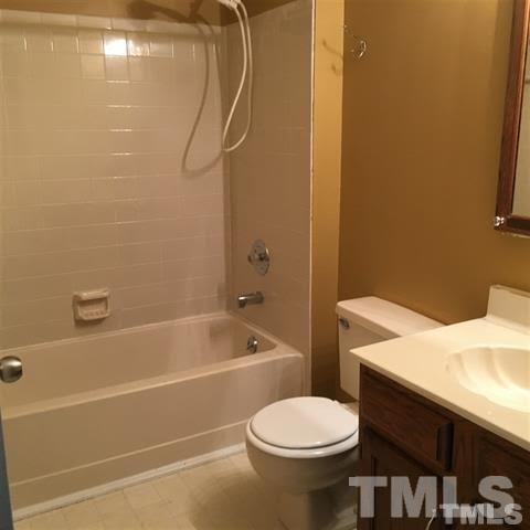 4311 Halliwell Drive Raleigh, NC 27606 - Photo 6 of 21 a bathroom with a sink a toilet and a bathtub