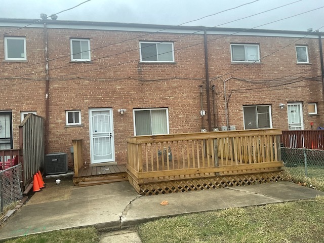 2223 171st Street Hazel Crest, IL 60429 - Photo 4 of 12 a view of a house with a wooden fence