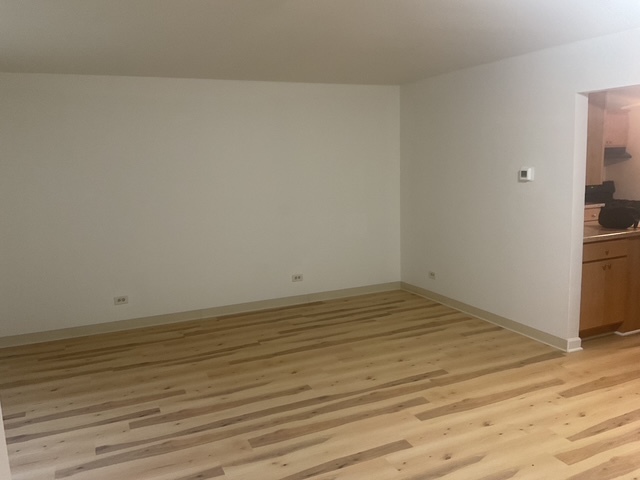 2223 171st Street Hazel Crest, IL 60429 - Photo 5 of 12 a view of a room with wooden floor and a sink