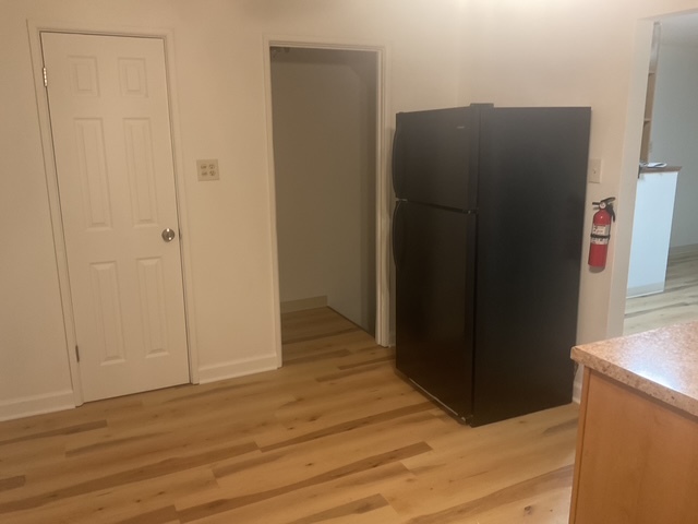 2223 171st Street Hazel Crest, IL 60429 - Photo 6 of 12 an empty room with wooden floor