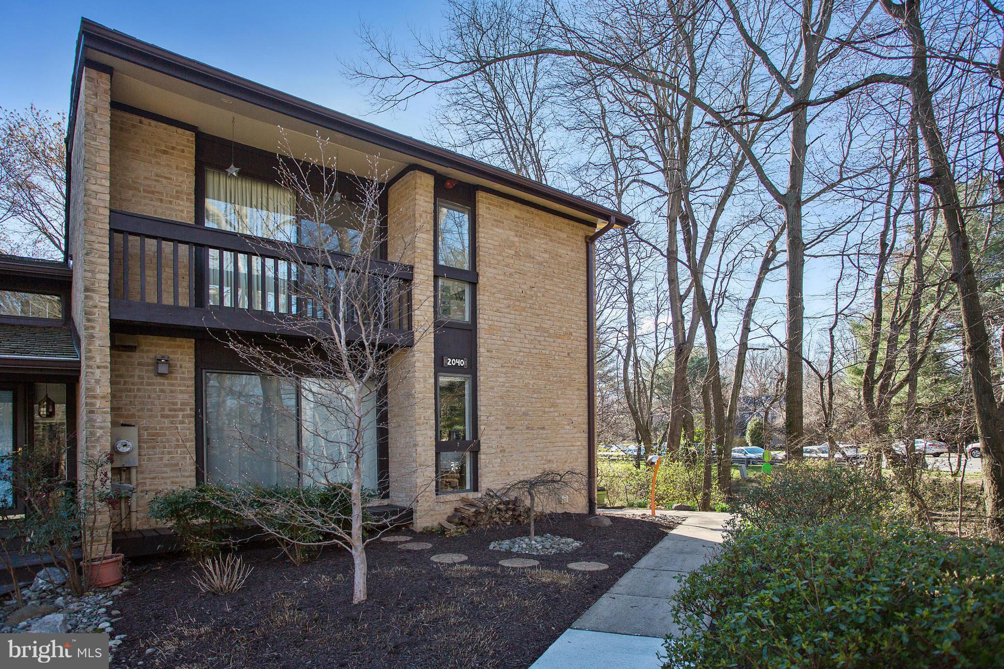 2040 Lakebreeze Way Reston, VA 20191 - Photo 1 of 29 a front view of a house with garden