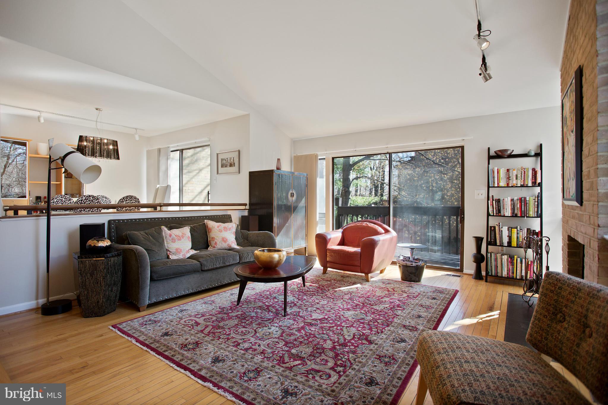2040 Lakebreeze Way Reston, VA 20191 - Photo 11 of 29 a living room with furniture couches and a flat screen tv