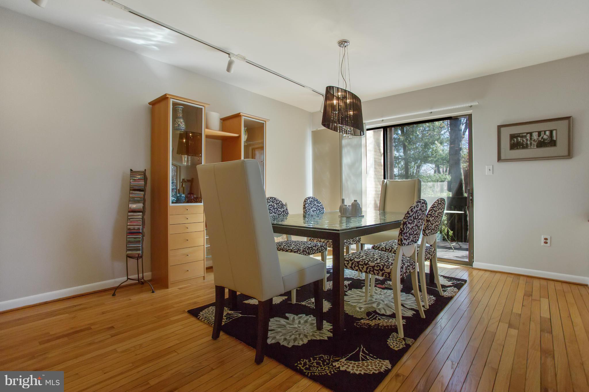 2040 Lakebreeze Way Reston, VA 20191 - Photo 12 of 29 a view of a dining room with furniture window and wooden floor