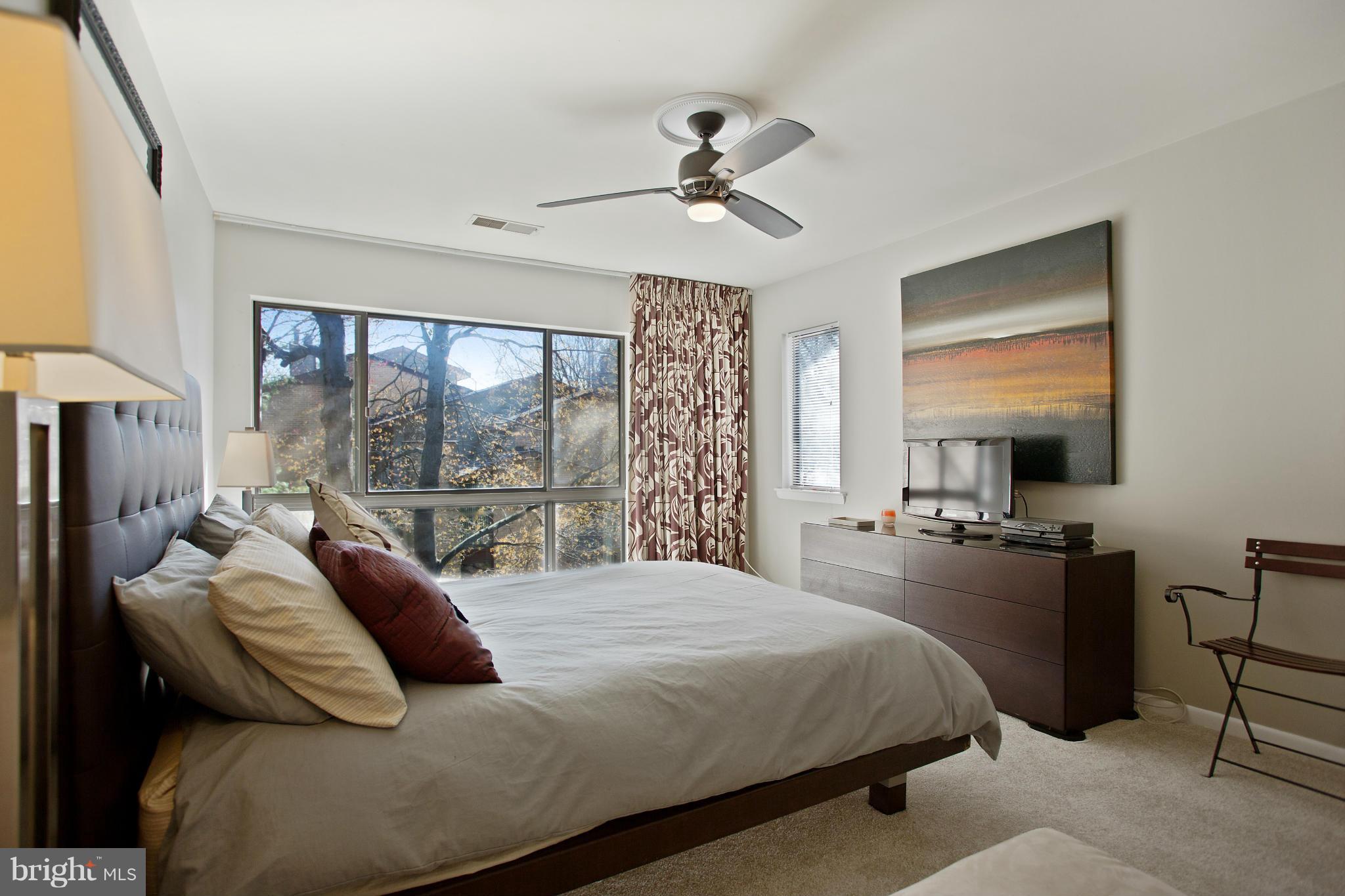 2040 Lakebreeze Way Reston, VA 20191 - Photo 17 of 29 a bedroom with a bed and a chandelier