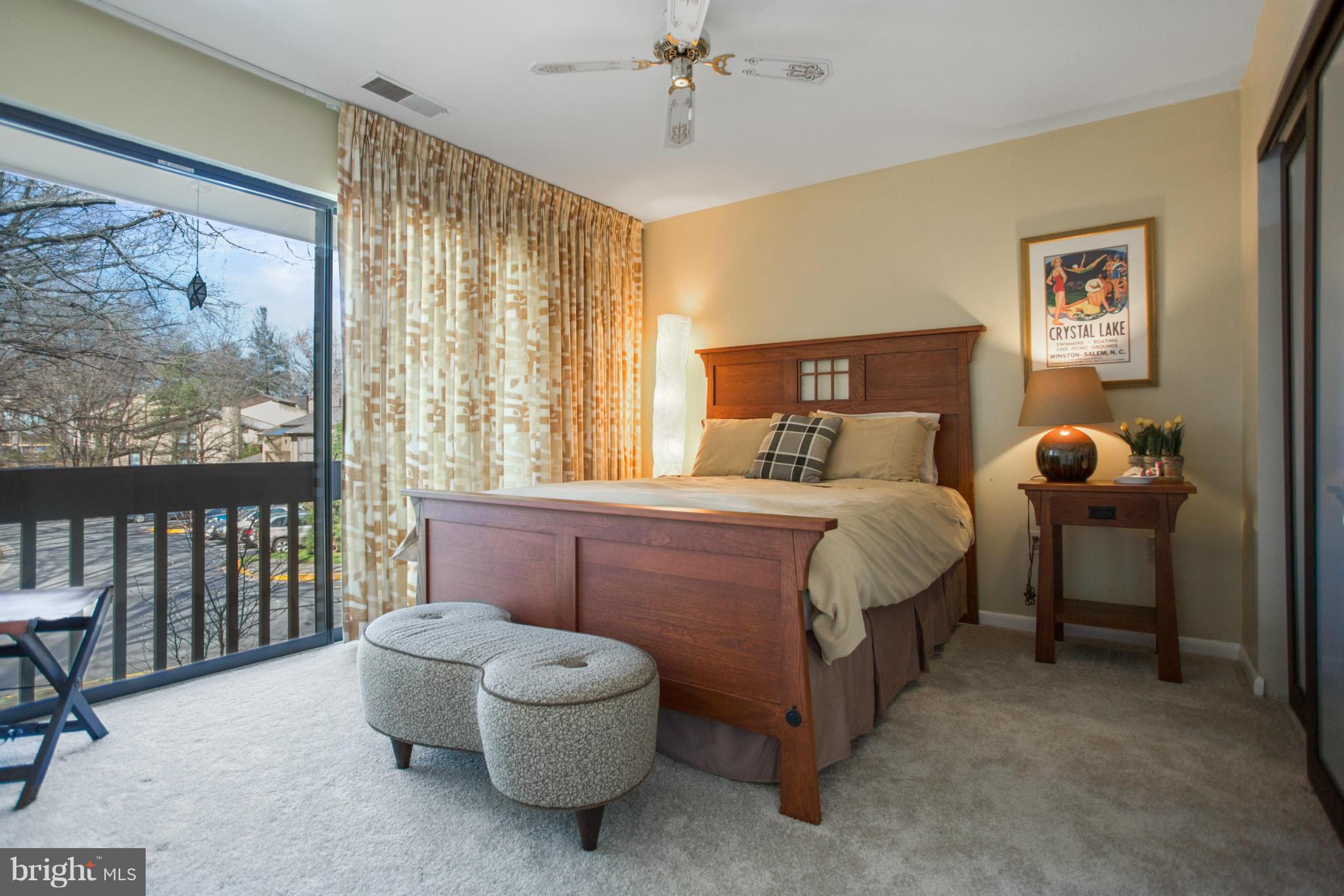 2040 Lakebreeze Way Reston, VA 20191 - Photo 19 of 29 a bedroom with a bed and a painting on the wall