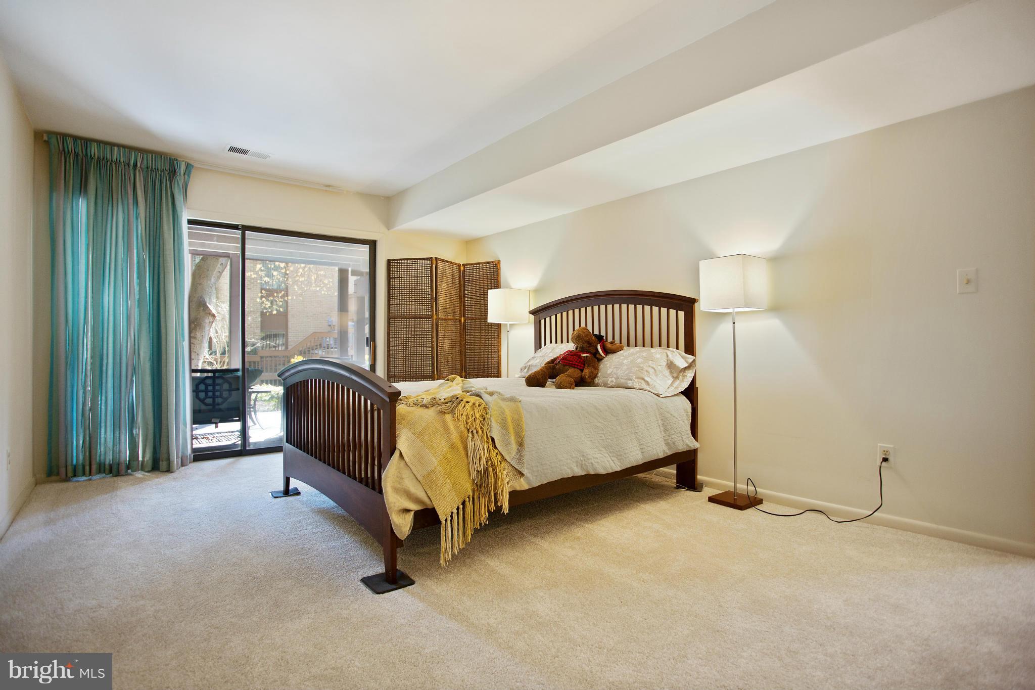 2040 Lakebreeze Way Reston, VA 20191 - Photo 23 of 29 a bedroom with a bed and a window