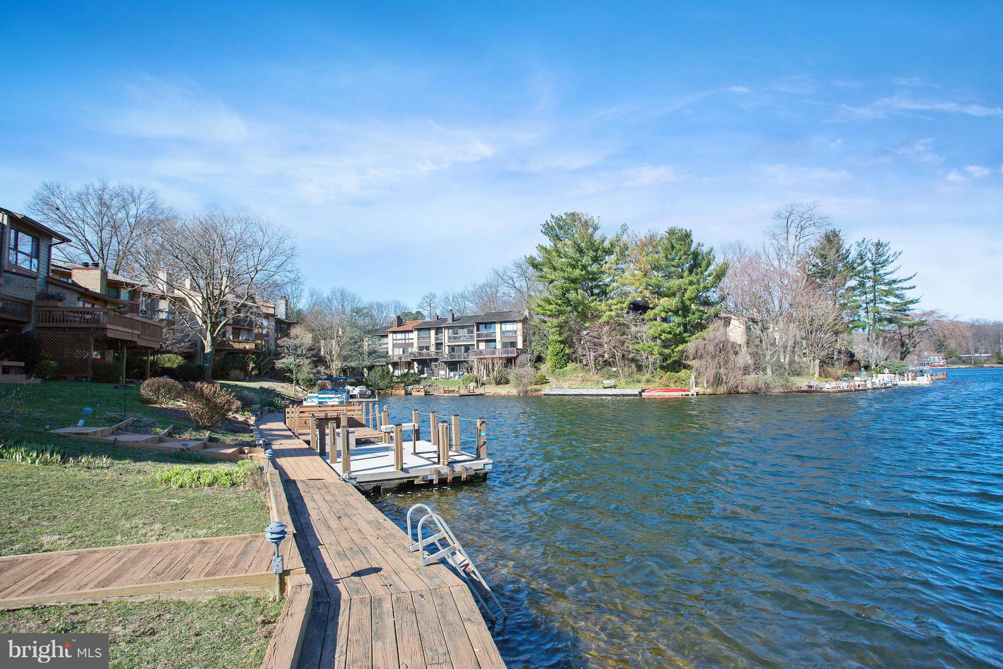 2040 Lakebreeze Way Reston, VA 20191 - Photo 5 of 29 a view of a lake with outdoor space