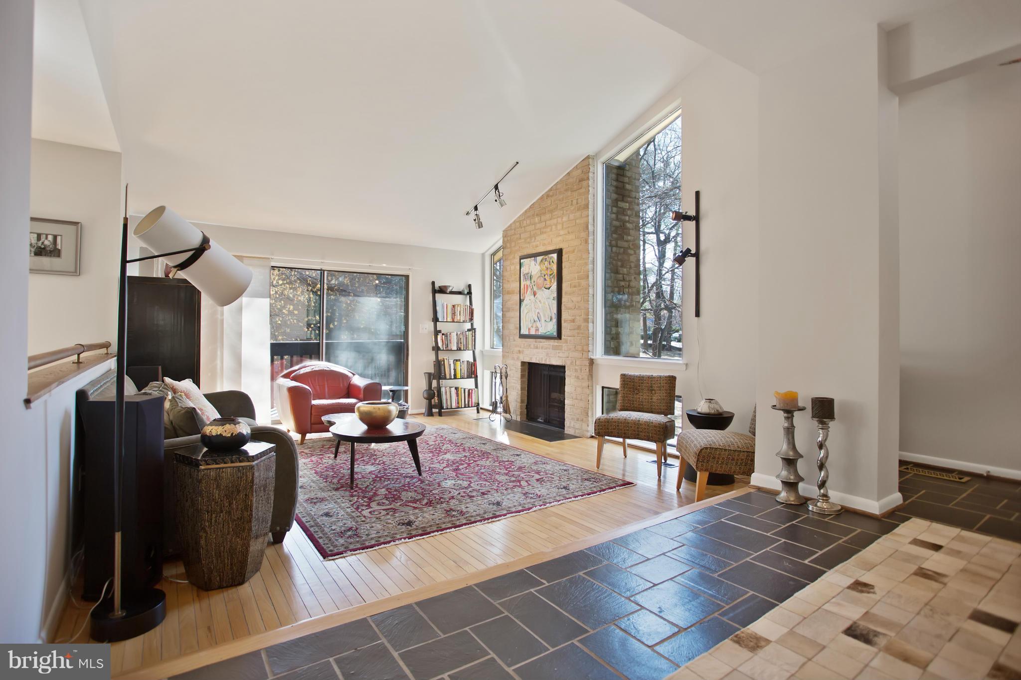 2040 Lakebreeze Way Reston, VA 20191 - Photo 10 of 29 a living room with furniture large window and a fireplace