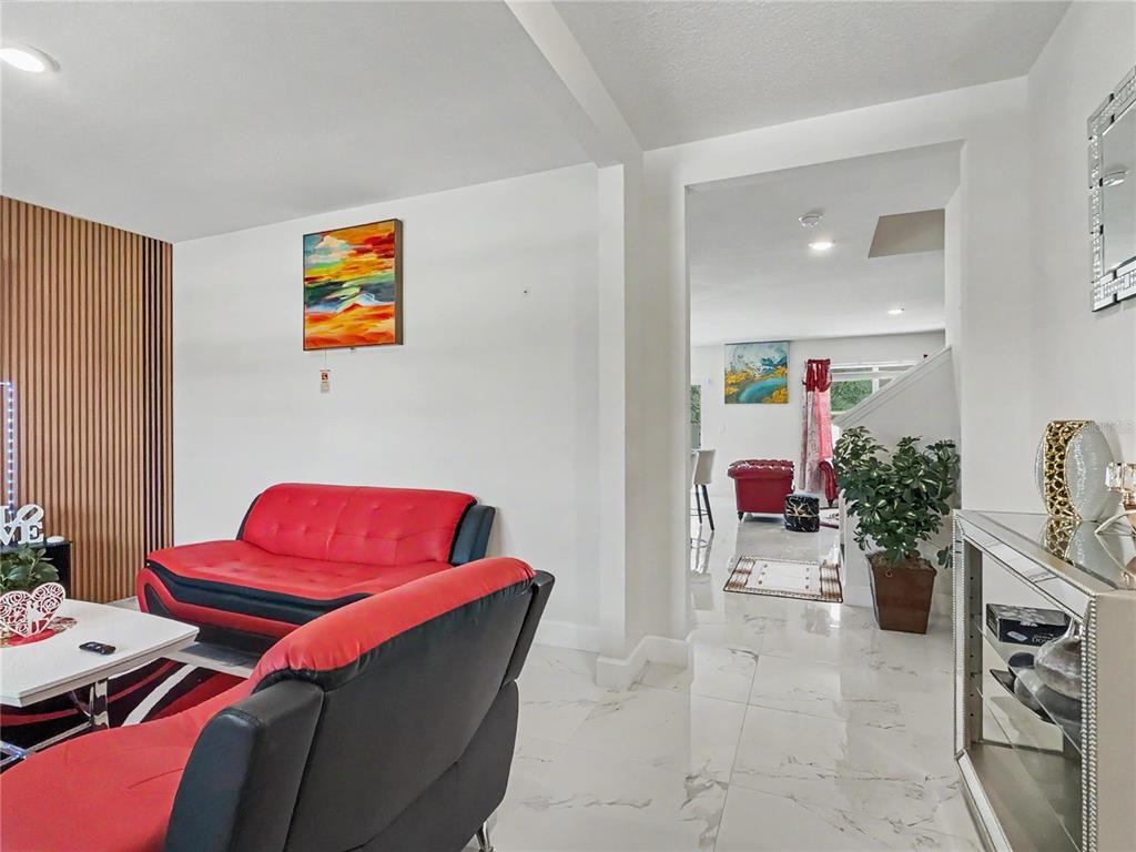 2085 Doe Run Drive Davenport, FL 33837 - Photo 11 of 44 a living room with furniture and a couch