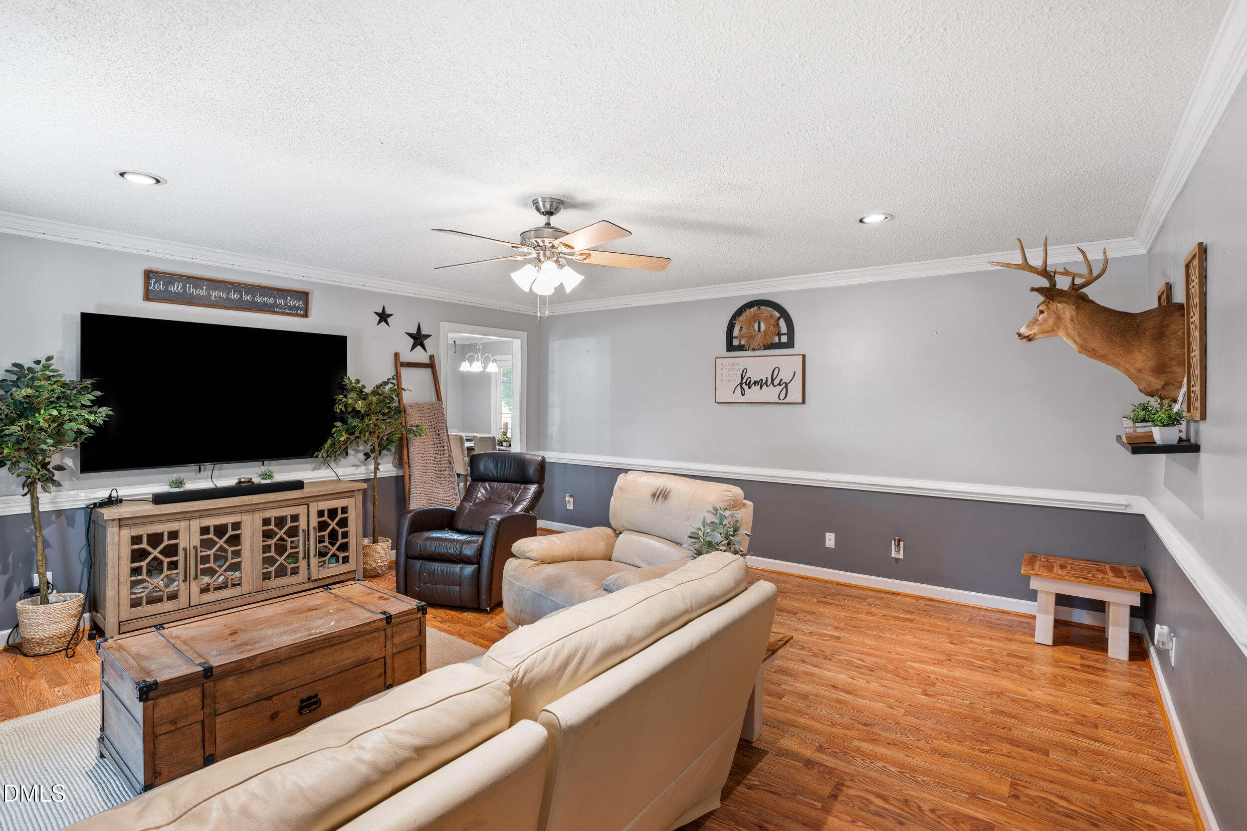 311 Bridgers Road Kenly, NC 27542 - Photo 15 of 46 a living room with furniture and a flat screen tv