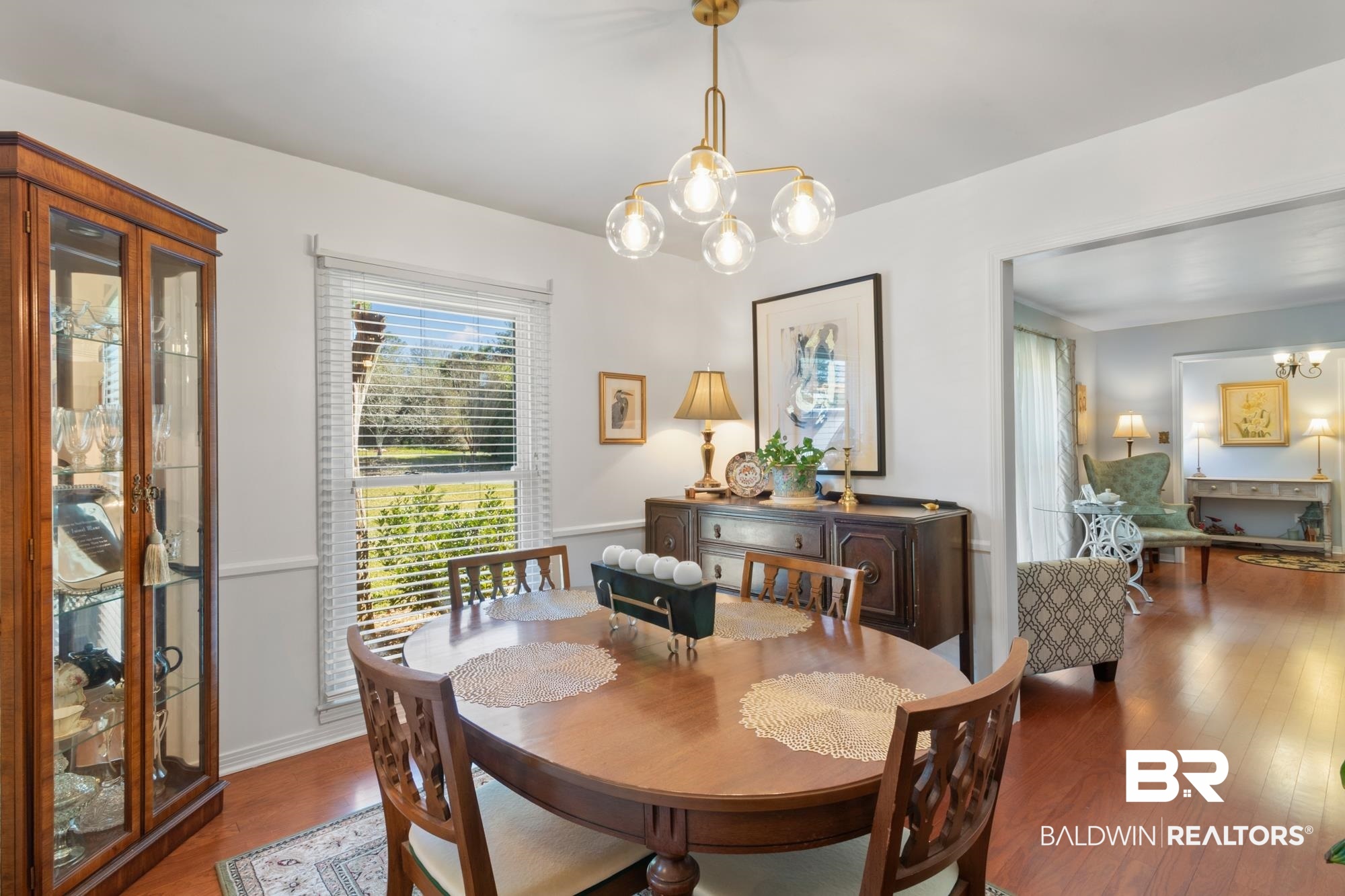 556 Stuart Street Daphne, AL 36526 - Photo 13 of 25 Dining space with dark hardwood / wood-style flooring and a chandelier