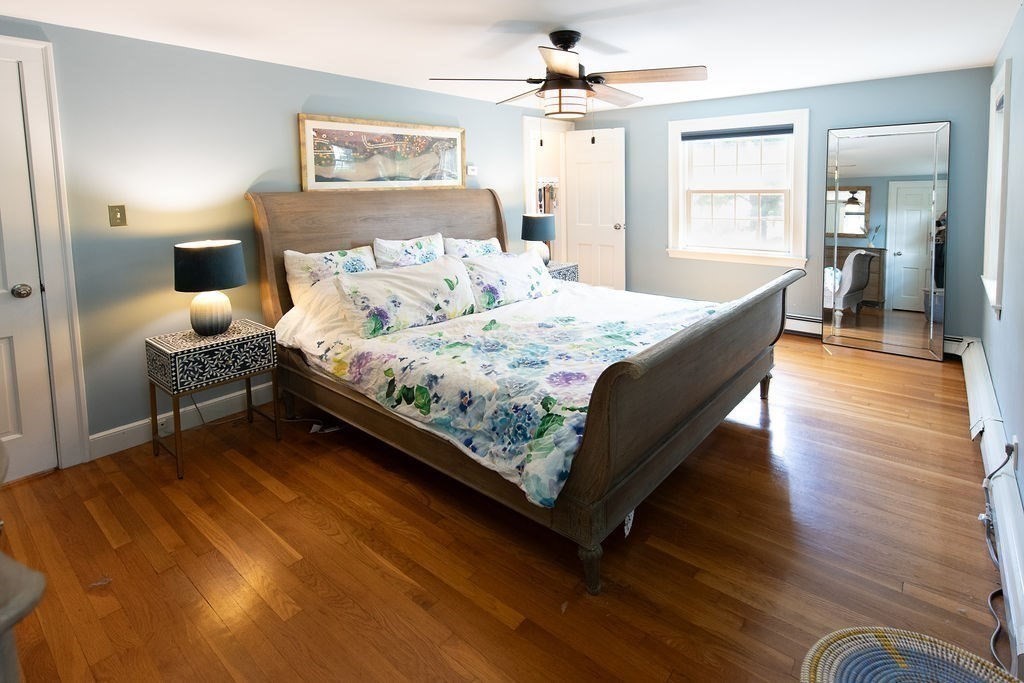 17 Eliot Road Belmont, MA 02478 - Photo 16 of 37 a bed room with a bed mirror and a window