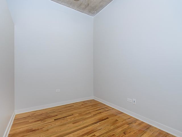 1151 West 15th Street, Unit 209 Chicago, IL 60608 - Photo 12 of 30 a view of empty room with wooden floor