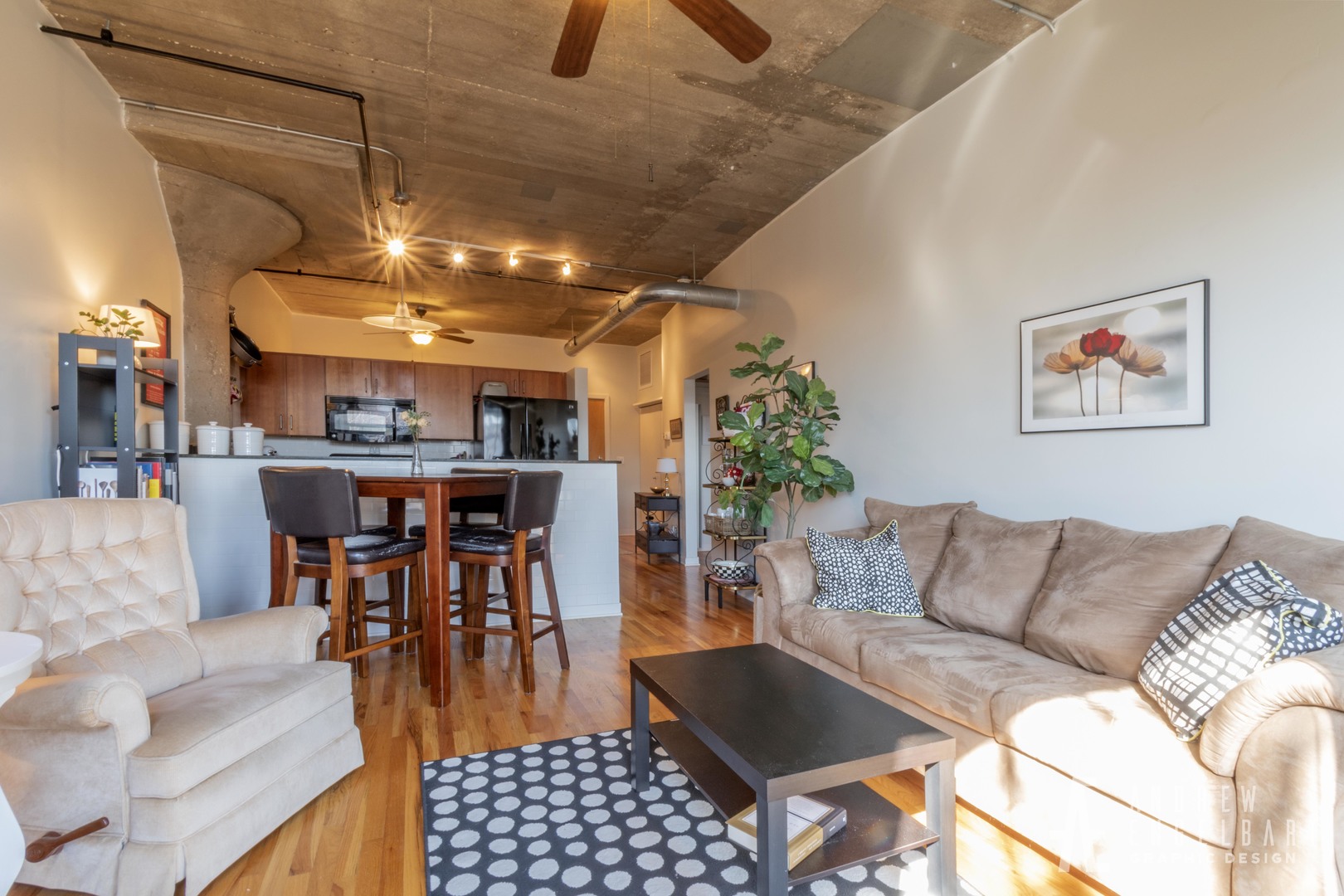 1151 West 15th Street, Unit 209 Chicago, IL 60608 - Photo 5 of 30 a living room with furniture kitchen view and a chandelier