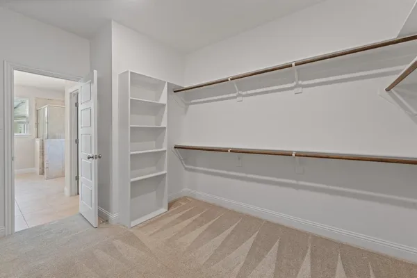 a view of an empty walk in closet
