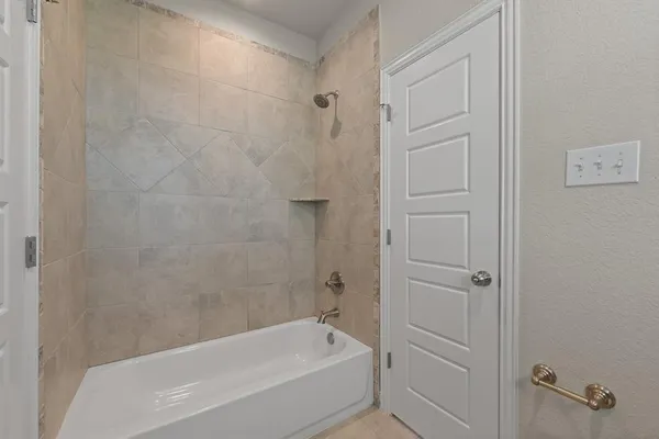 a kitchen with granite countertop cabinets stainless steel appliances and a wooden floor