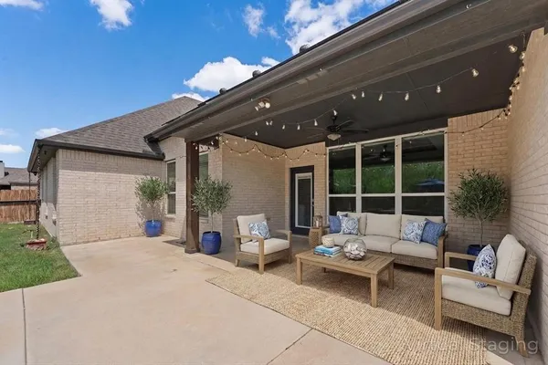 a view of a swimming pool in a backyard