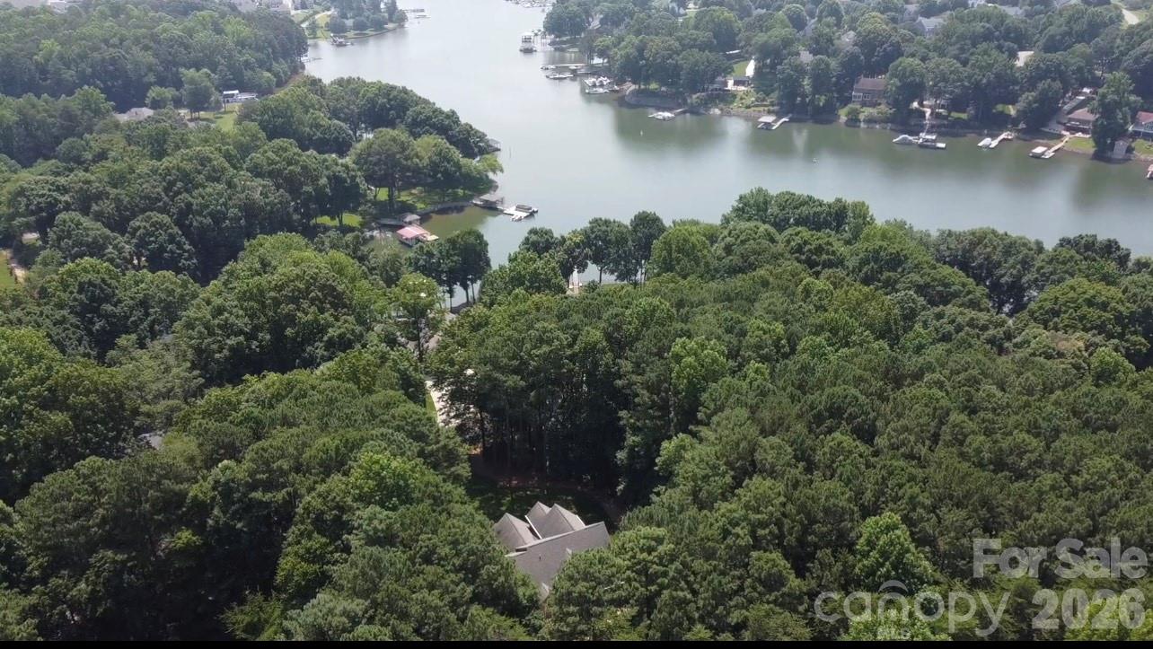 0 Whippoorwill Road, Unit 35 Mooresville, NC 28117 - Photo 3 of 4 an aerial view of residential houses with outdoor space and trees all around