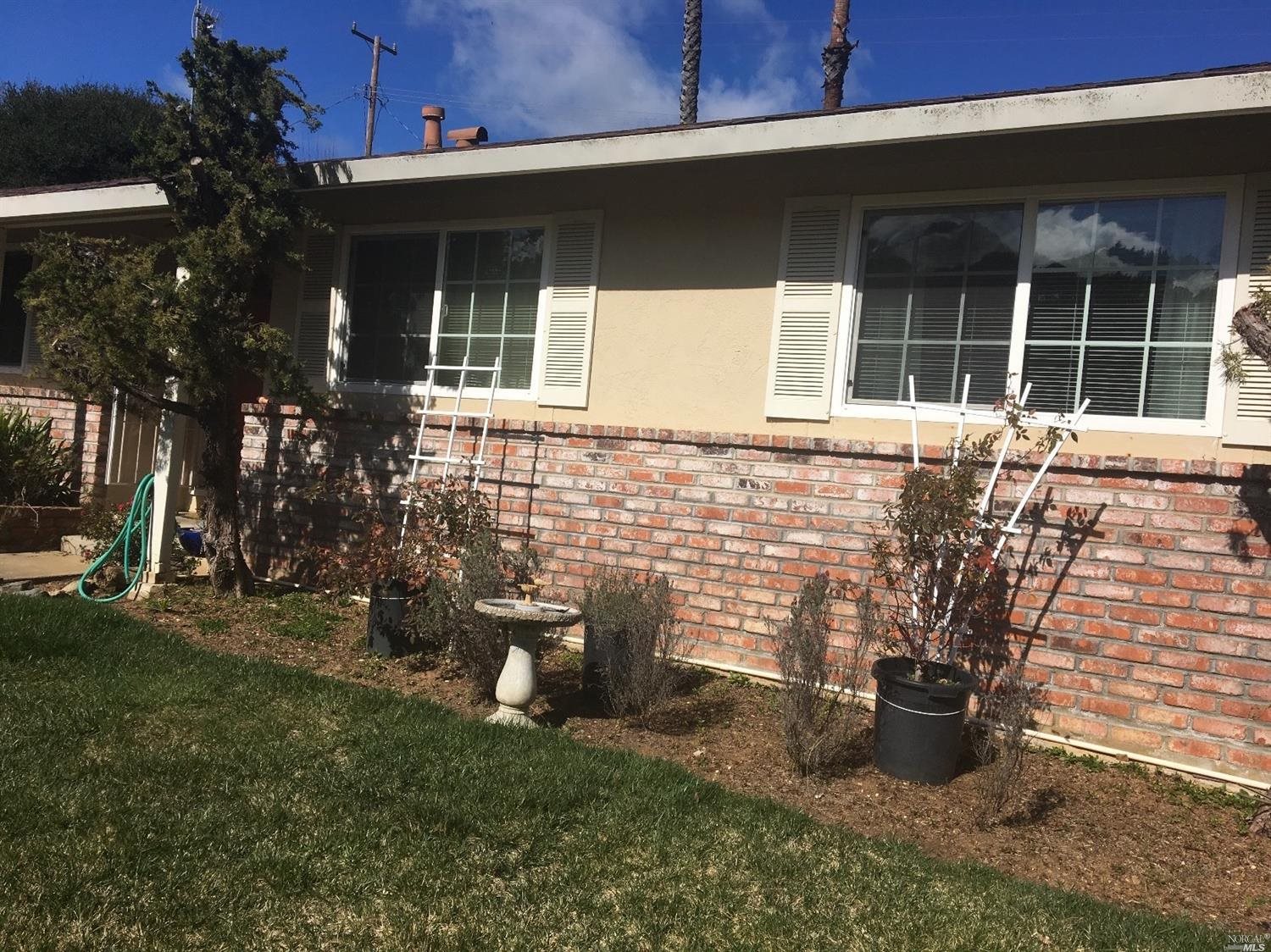 2584 Center Road Novato, CA 94947 - Photo 1 of 1 a front view of a house with a yard