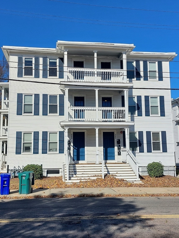 a front view of residential houses with street