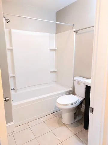 a bathroom with a toilet a sink and a bathtub
