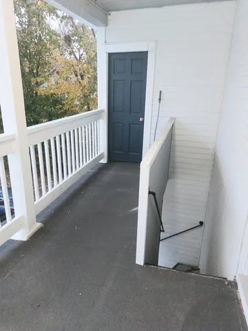a view of staircase and door