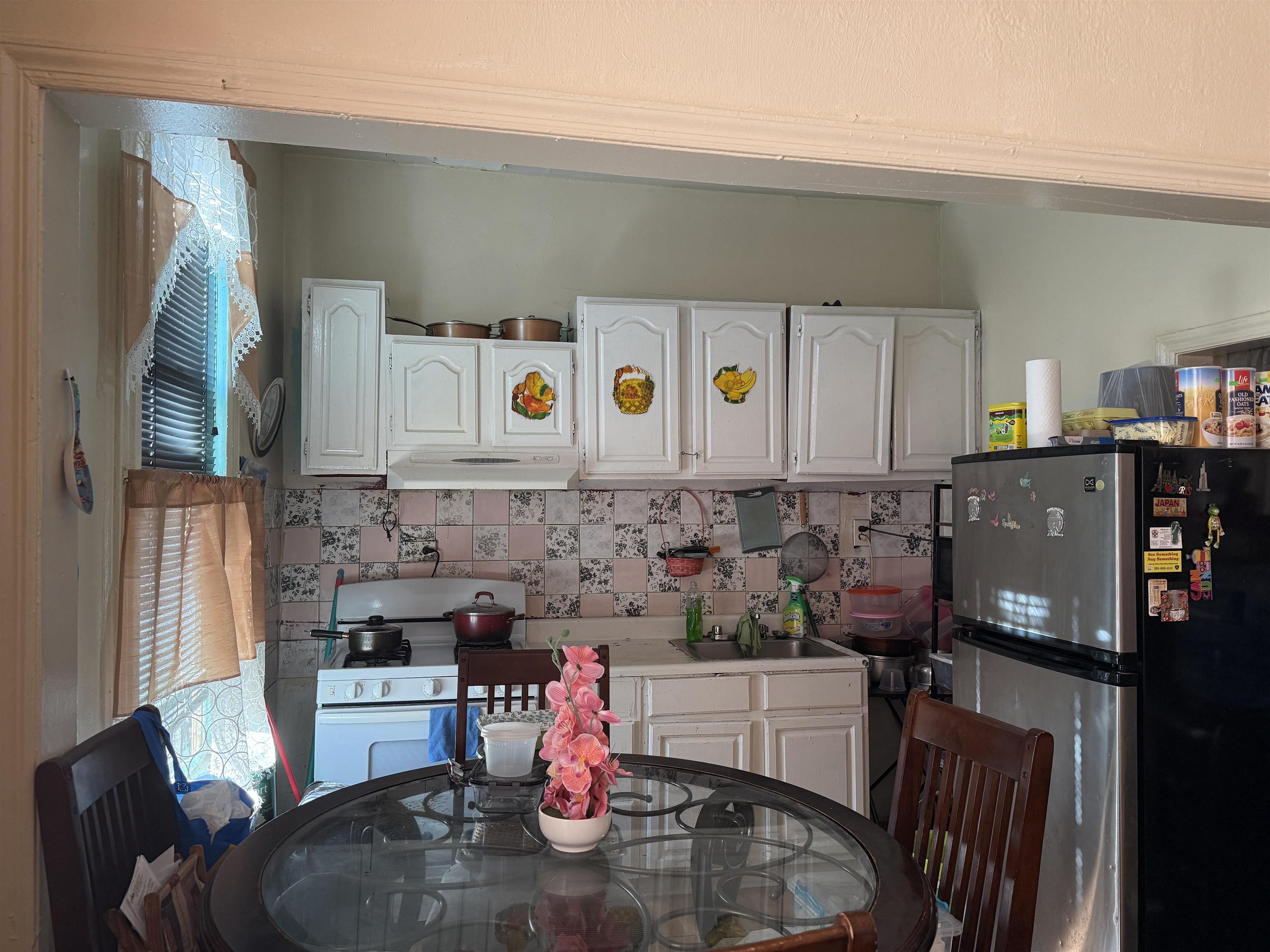 1309 Summit Avenue Union City, NJ 07087 - Photo 19 of 31 a kitchen with stainless steel appliances kitchen island granite countertop a refrigerator a stove a sink and dishwasher with wooden floor