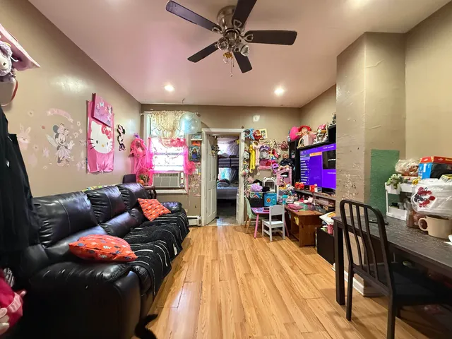 a outdoor living space with furniture and a flat screen tv