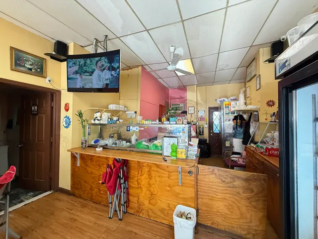 a view of a dining room with furniture kitchen and chandelier