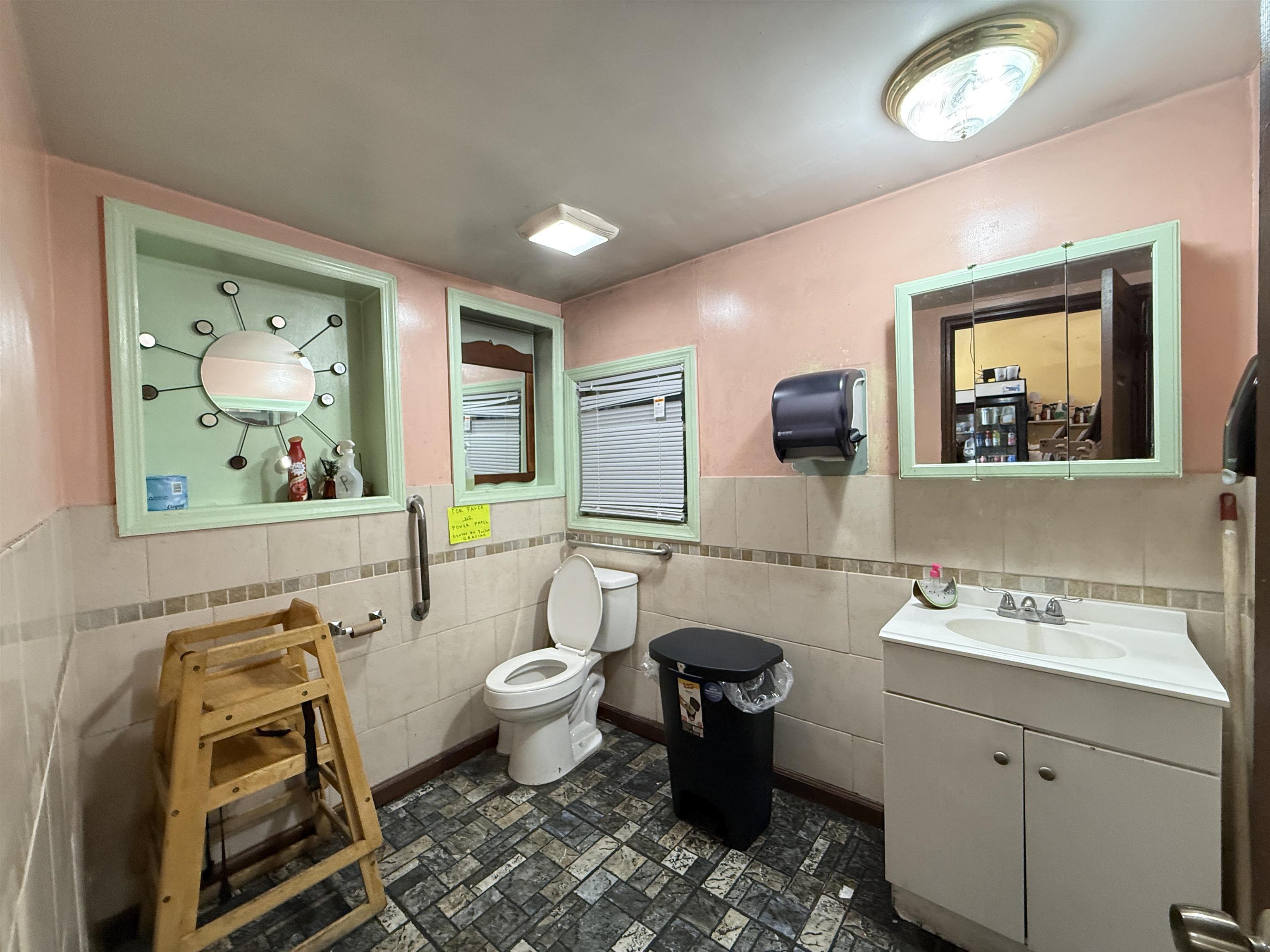 1309 Summit Avenue Union City, NJ 07087 - Photo 6 of 31 a bathroom with a sink mirror and painting on the wall