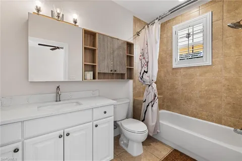 a bedroom with a large bed and a large window