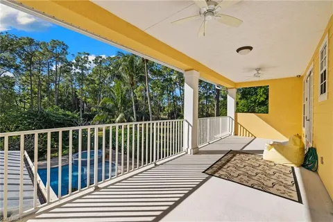 a view of a backyard with sitting area