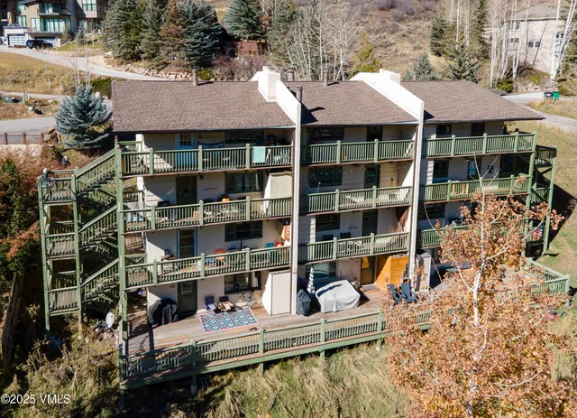 a group of people sitting in front of retail shop