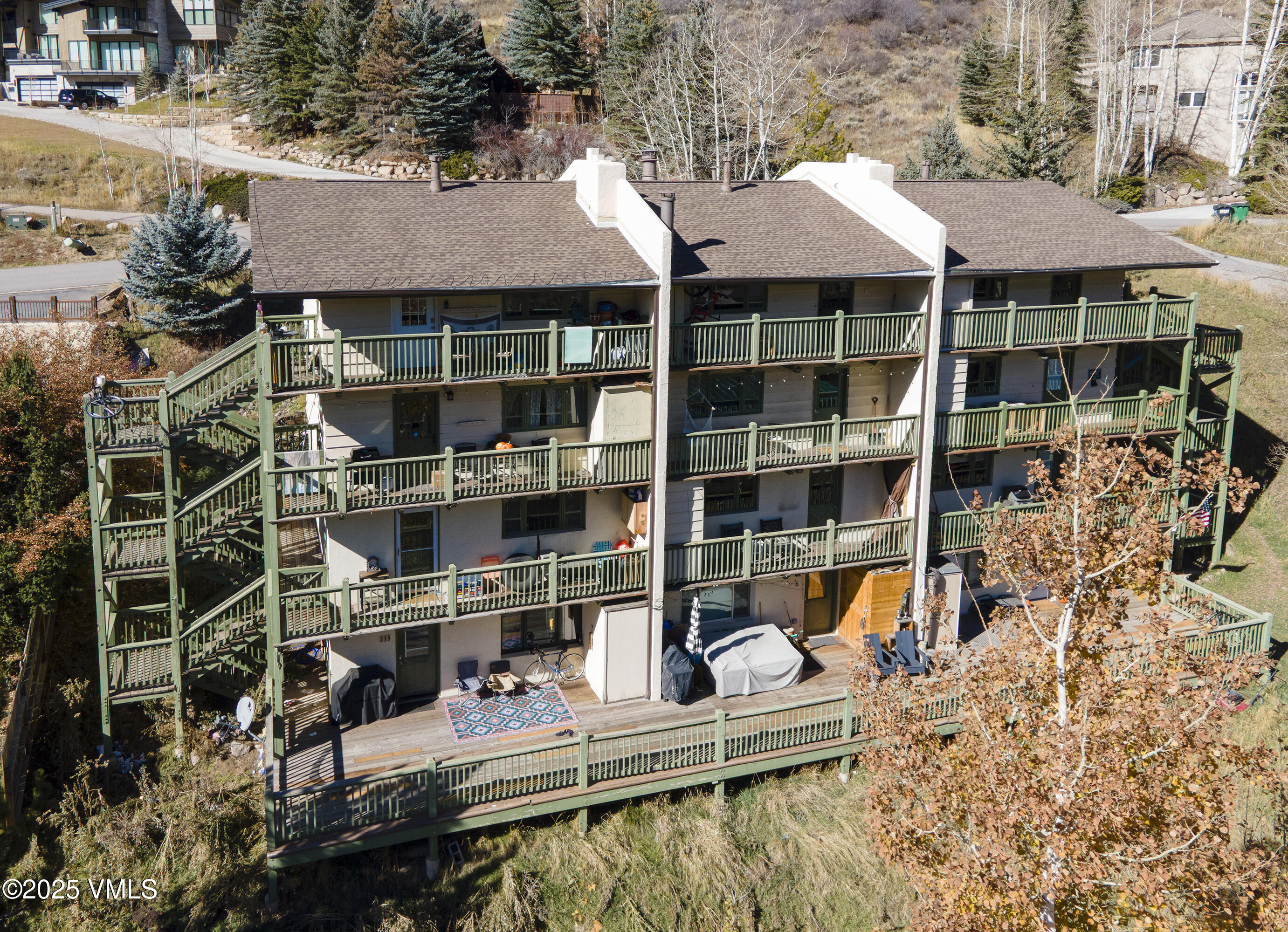 2448 Garmisch Drive, Unit 4 Vail, CO 81657 - Photo 16 of 19 a view of house with large windows and a tree