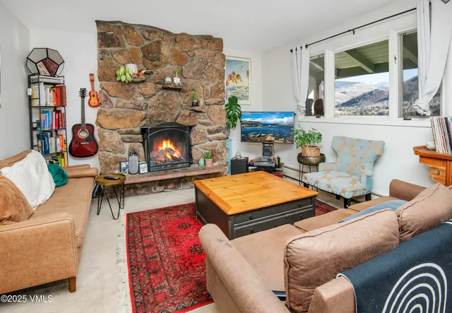 a living room with furniture fireplace and a flat screen tv