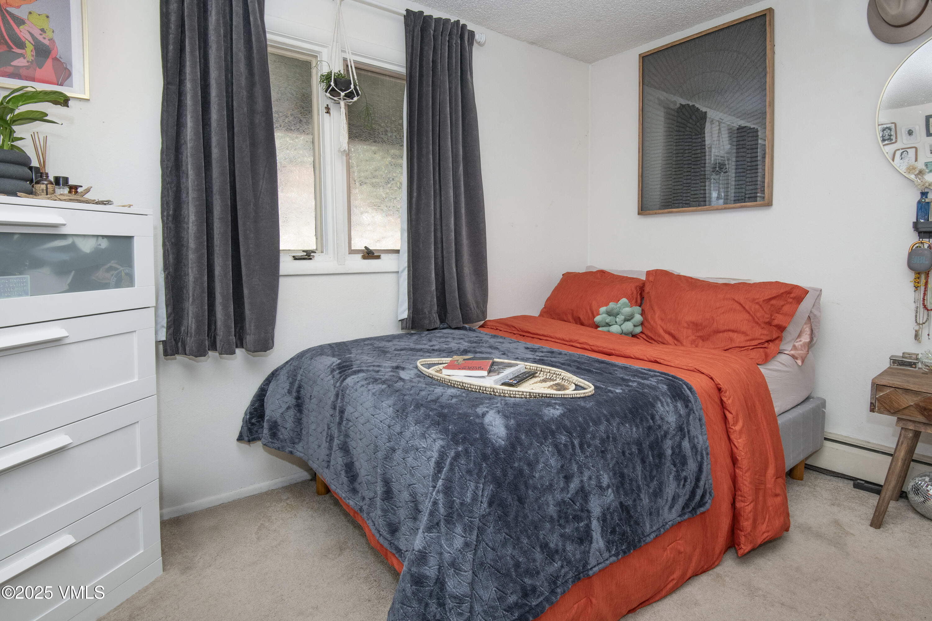 2448 Garmisch Drive, Unit 4 Vail, CO 81657 - Photo 10 of 19 a bedroom with a bed and a window