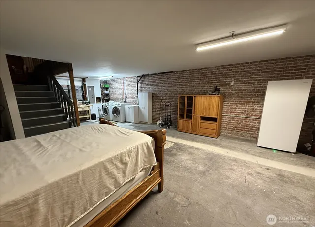 a bedroom with a bed and window