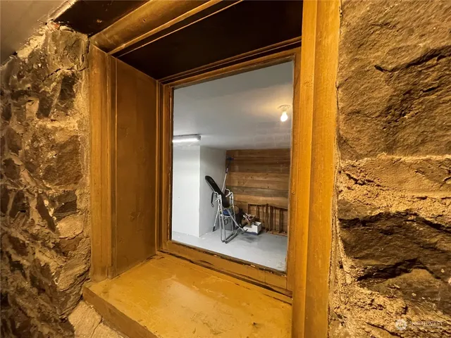 a view of a balcony and car parked