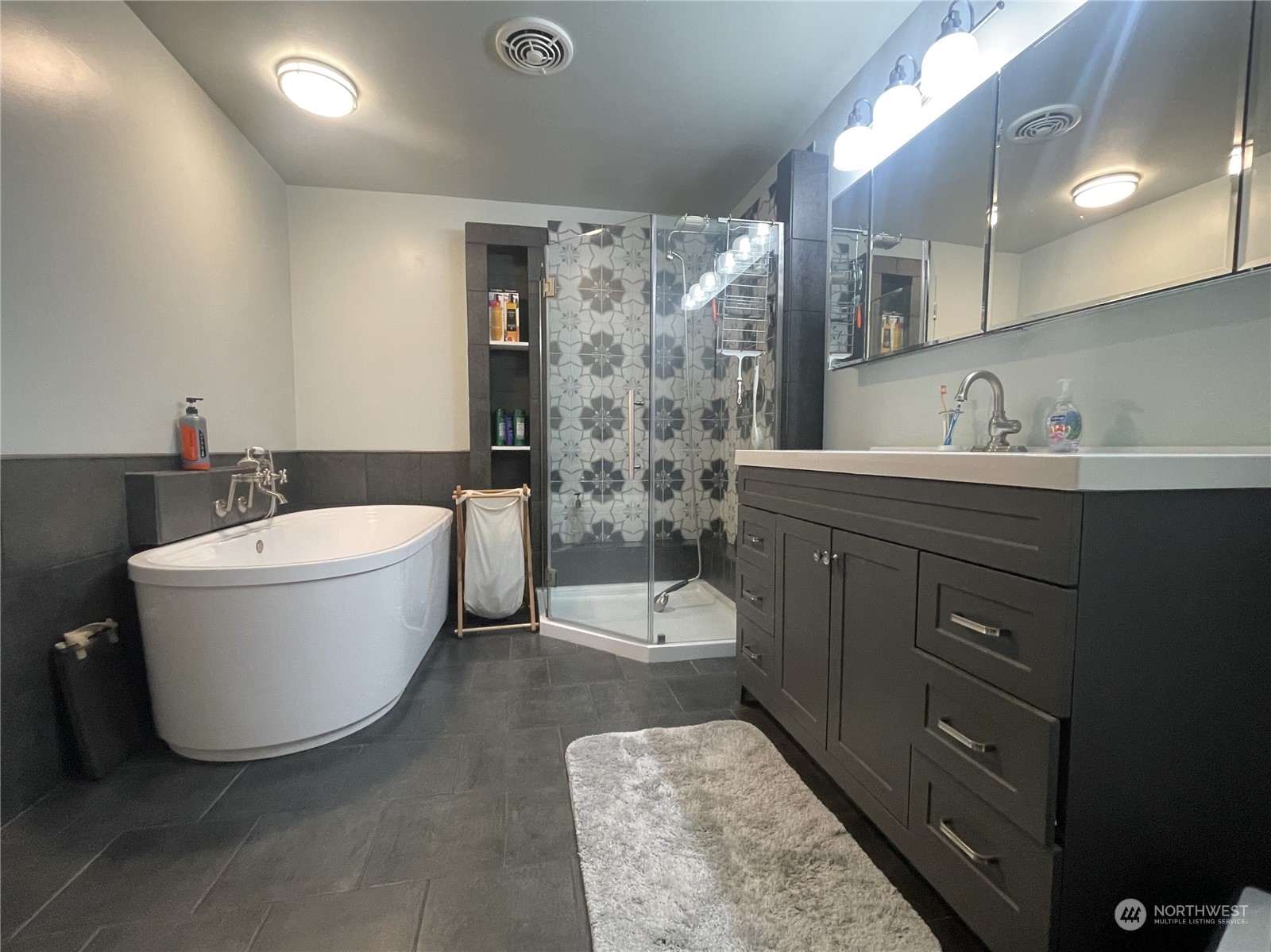 358 East Main Street Dayton, WA 99328 - Photo 7 of 37 a bathroom with a bathtub sink mirror and toilet