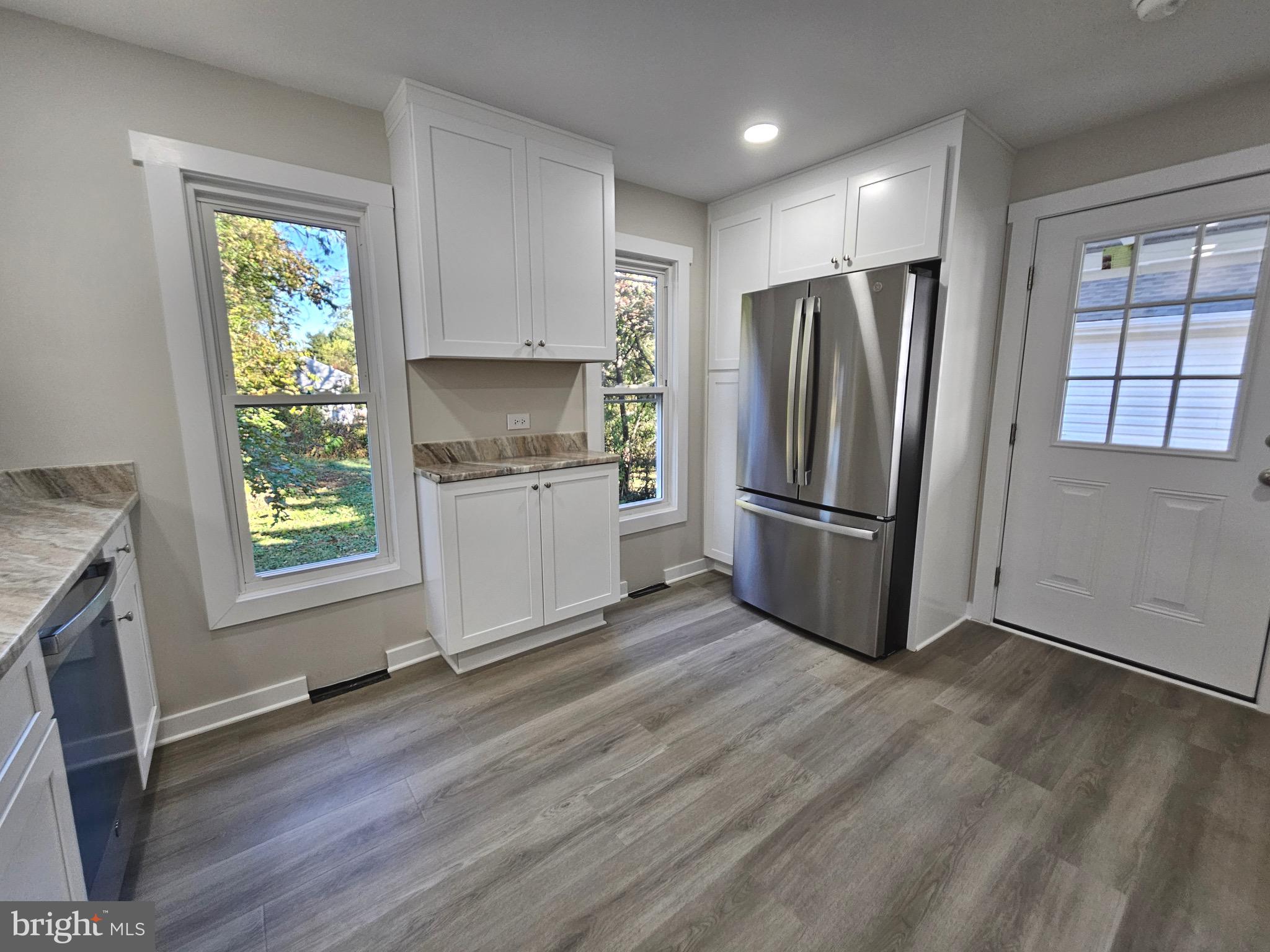 161 East Main Street Orange, VA 22960 - Photo 12 of 19 a kitchen with stainless steel appliances a refrigerator sink and microwave