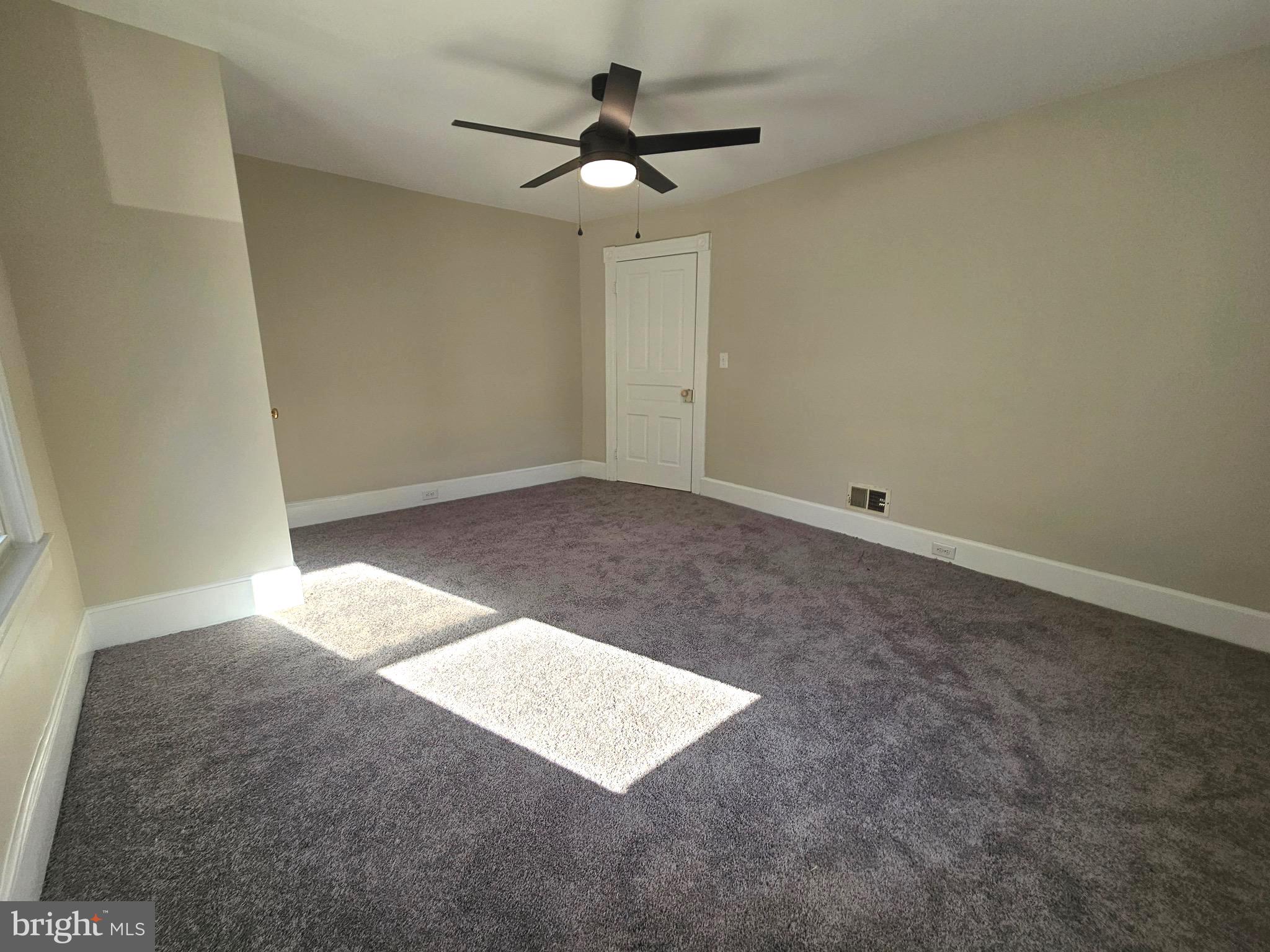 161 East Main Street Orange, VA 22960 - Photo 14 of 19 an empty room with fan and windows