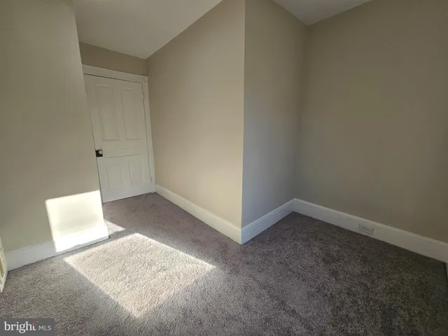 a bathroom with a toilet sink vanity tub and shower