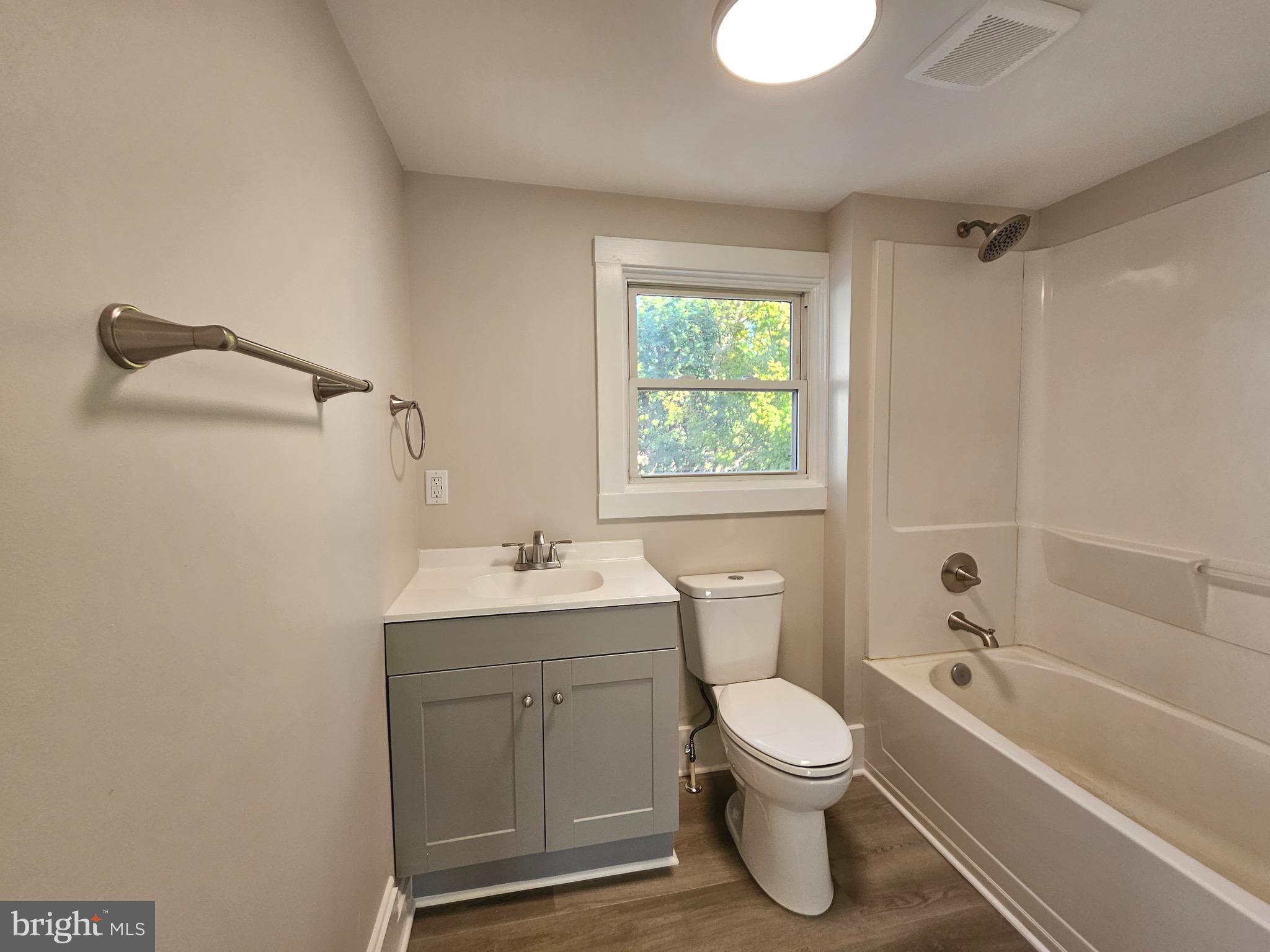 161 East Main Street Orange, VA 22960 - Photo 18 of 19 a bathroom with a toilet sink vanity tub and shower
