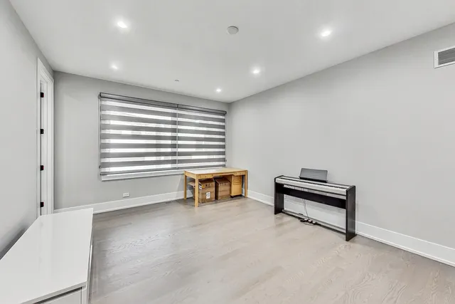 a view of workspace with furniture and a window