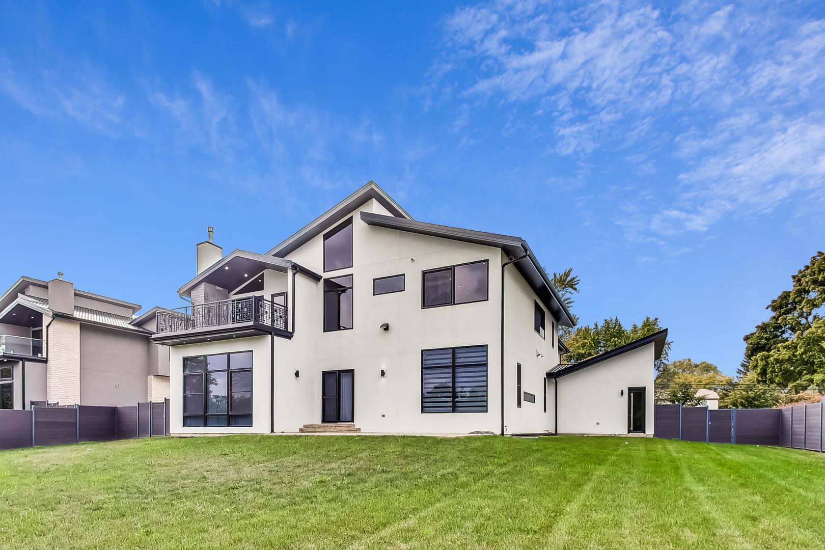 1331 Pfingsten Road Northbrook, IL 60062 - Photo 37 of 38 a front view of a house with a yard