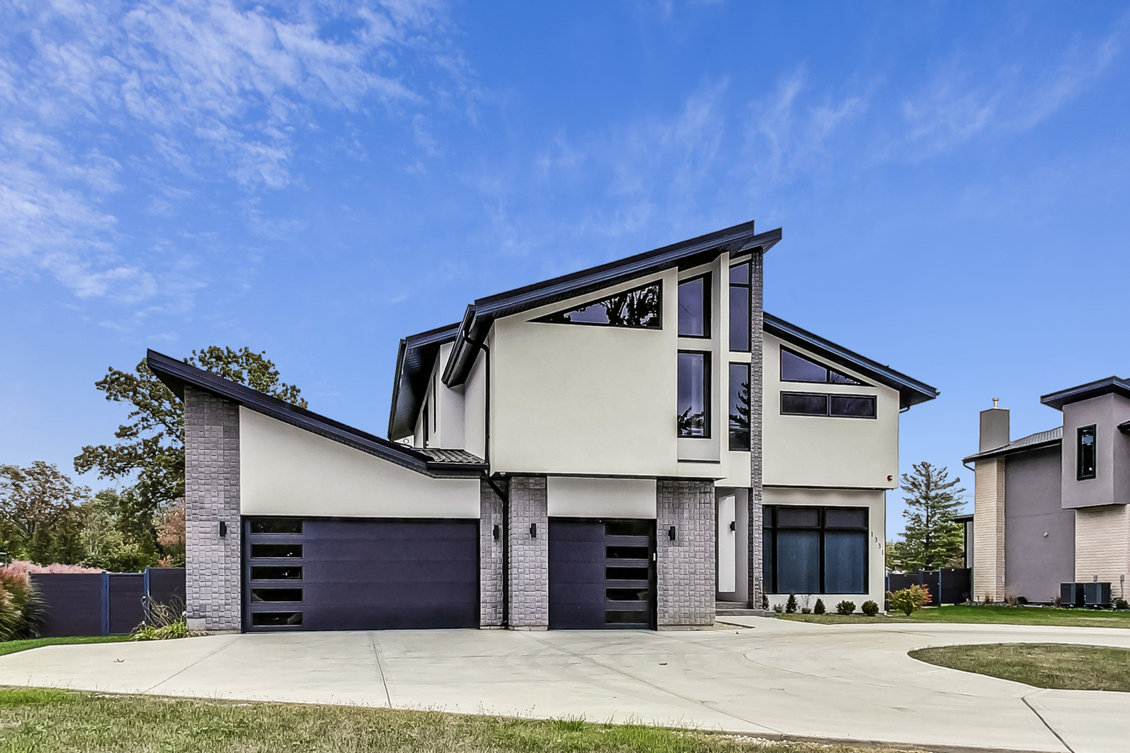 1331 Pfingsten Road Northbrook, IL 60062 - Photo 5 of 38 a front view of a house with a garage