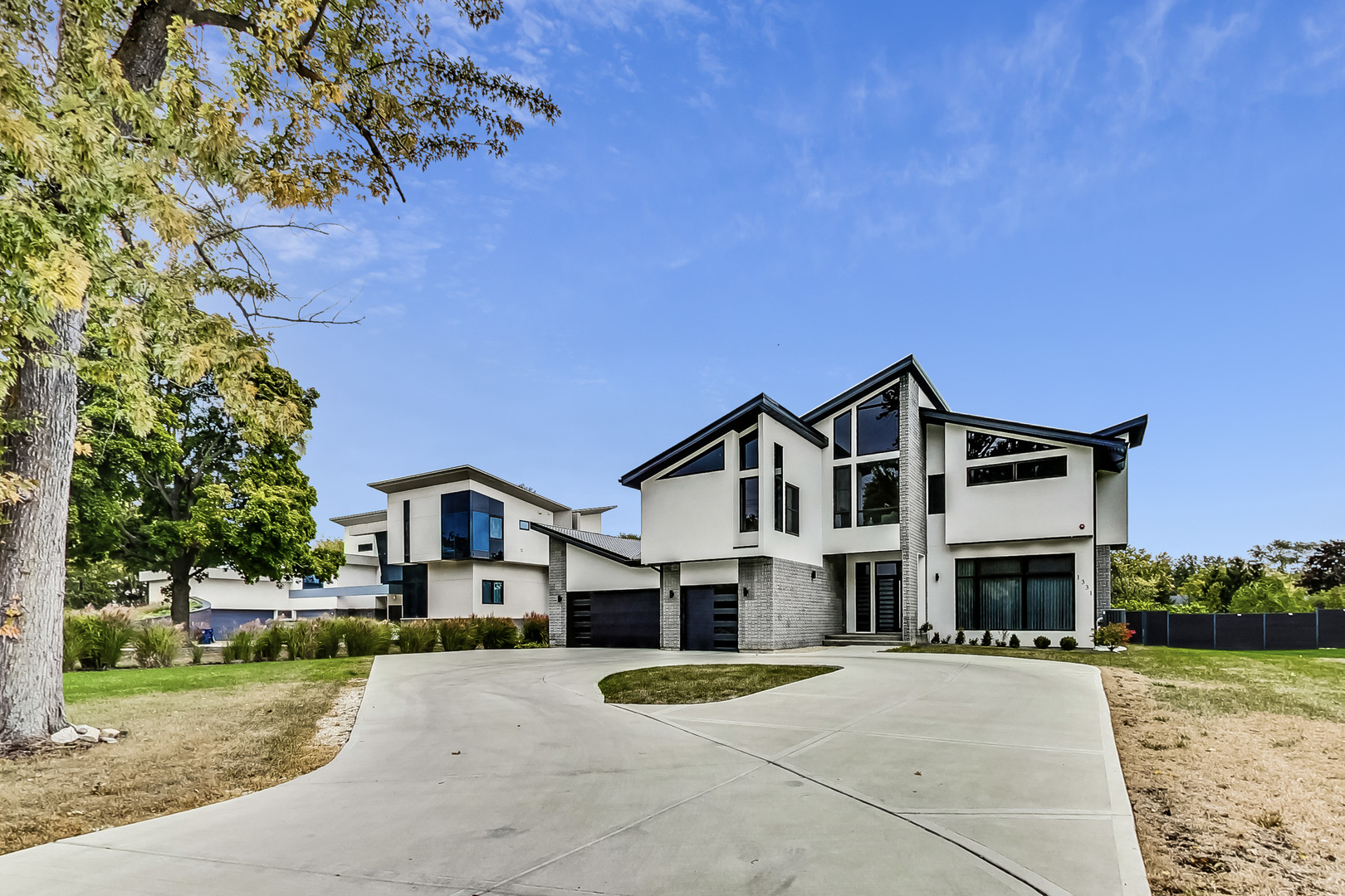 1331 Pfingsten Road Northbrook, IL 60062 - Photo 7 of 38 a front view of a house with a yard