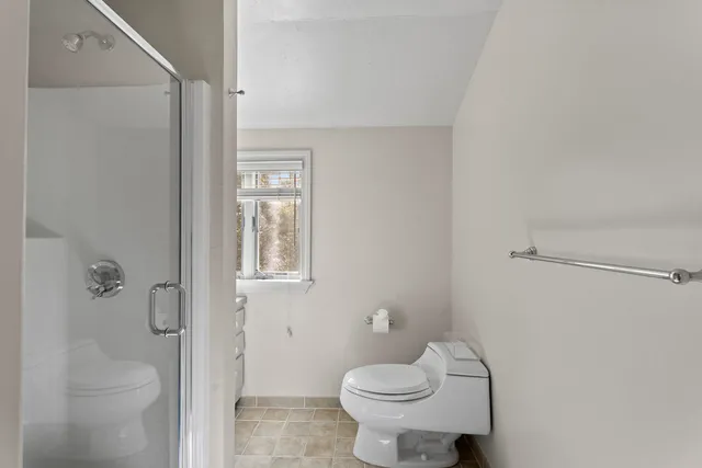 a work room with furniture and a window