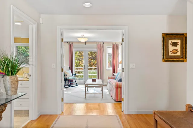 a living room with furniture and a lamp